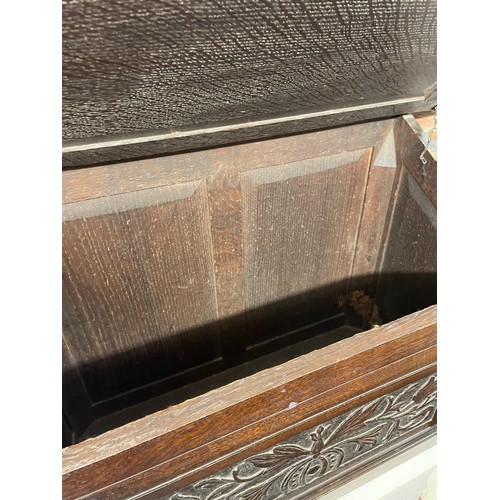 112 - OAK CARVED PANEL SLANT FRONTED BOX