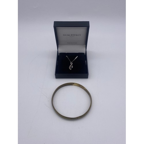 652 - 9CT WHITE GOLD SAPPHIRE PENDANT ON ROPE TWIST CHAIN 3G APPROX AND AN UNMARKED YELLOW BANGLE