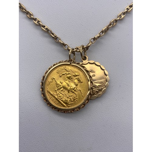 656 - 1912 GEORGE V SOVEREIGN AND A 9CT GOLD ST CHRISTOPHER PENDANT ON 9CT CHAIN 25G OVERALL APPROX