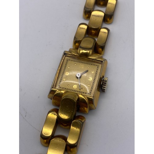 663 - LADIES GOLD PLATED SQUARE FACED WRIST WATCH ON LINK STRAP