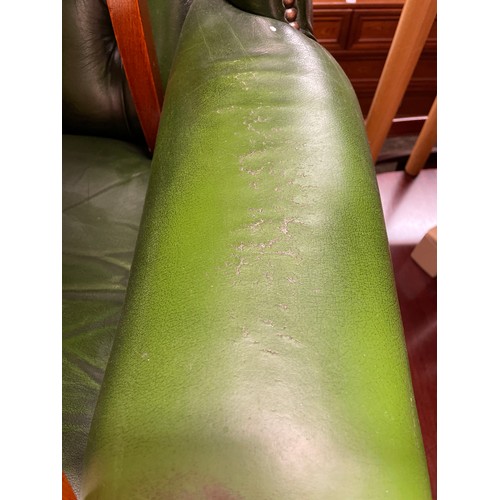 50 - BOTTLE GREEN BUTTON BACK LEATHER WING ARM CHAIR