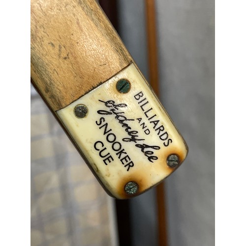 81 - TWO SNOOKER CUES IN TUBE HOLDERS, AND A COMBI CASE WITH CUE