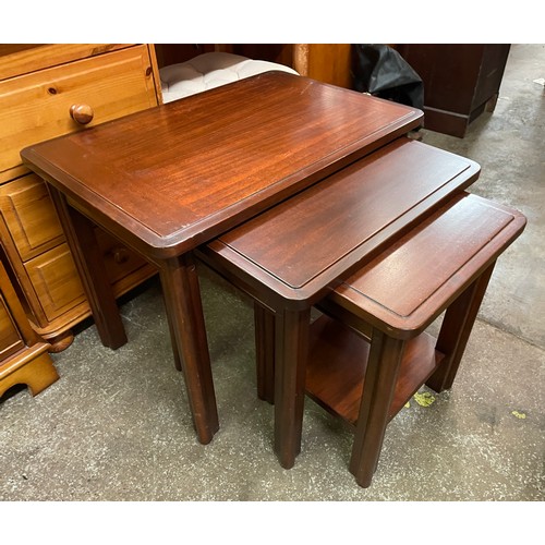 33 - NEST OF MAHOGANY TABLES