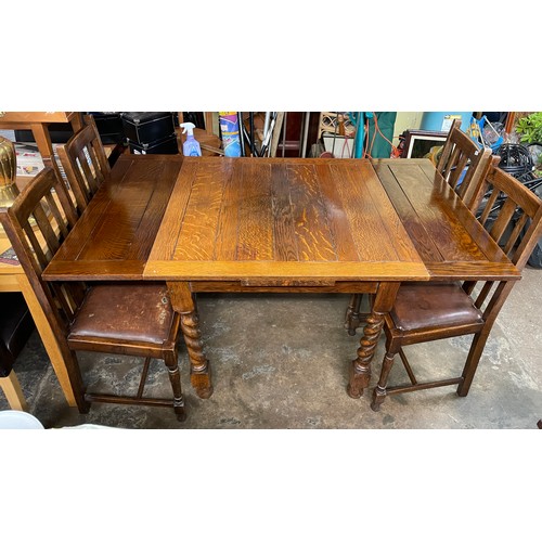 39 - OAK BARLEY TWIST DRAWER LEAF TABLE AND FOUR CHAIRS