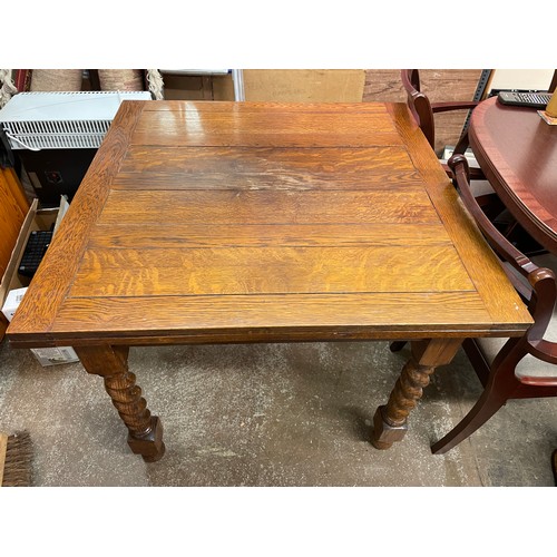 39 - OAK BARLEY TWIST DRAWER LEAF TABLE AND FOUR CHAIRS