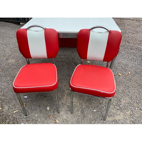 85 - AMERICAN DINER STYLE RED AND WHITE UPHOLSTERED CHROME TABLE WITH BENCH SEAT AND SIDE CHAIRS