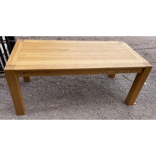 94 - CONTEMPORARY OAK OBLONG DINING TABLE ON CHUNKY SQUARE LEGS