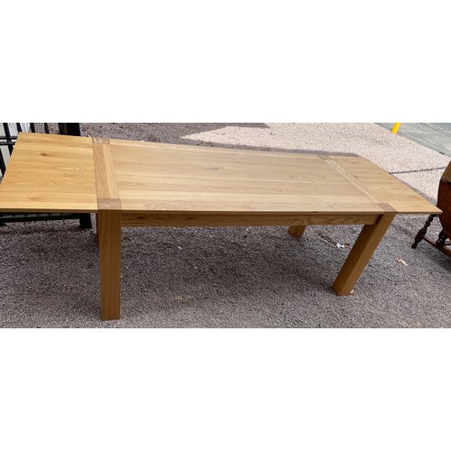 94 - CONTEMPORARY OAK OBLONG DINING TABLE ON CHUNKY SQUARE LEGS