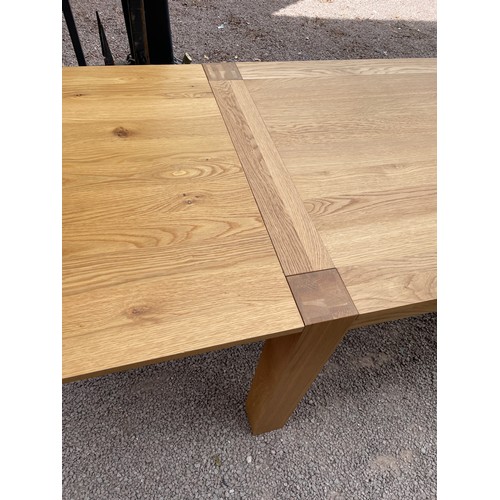 94 - CONTEMPORARY OAK OBLONG DINING TABLE ON CHUNKY SQUARE LEGS