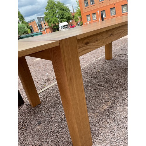 94 - CONTEMPORARY OAK OBLONG DINING TABLE ON CHUNKY SQUARE LEGS