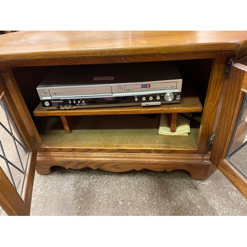 88 - OAK LEADED GLAZED MEDIA UNIT CONTAINING A PANASONIC VHS VCR DVD