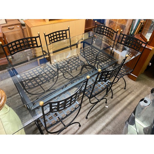 142 - WROUGHT IRON FRAMED GLASS TOPPED DINING TABLE WITH SIX LATTICE WORK CHAIRS