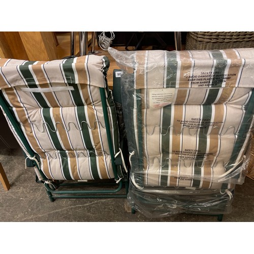 90 - PAIR OF GREEN AND STRIPED FABRIC RECLINING GARDEN ARMCHAIRS