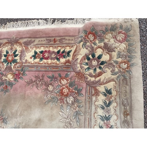 120 - LARGE WOOLEN FLORAL PATTERN CARPET ON PINK GROUND 370cm x 265cm