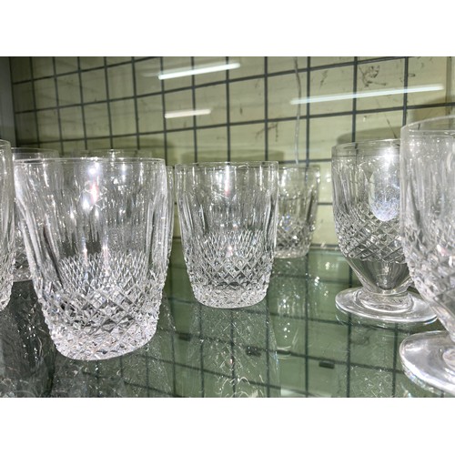 463 - SHELF OF WATERFORD CRYSTAL COLLEEN PATTERN SUITES OF SIX MID AND LARGE TUMBLERS, AND VARIOUS WINES