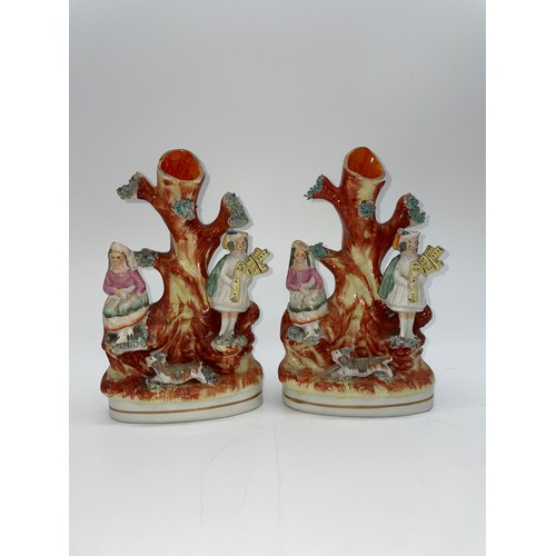 487 - PAIR OF STAFFORDSHIRE PIPER AND GIRL FLAT BACK SPILL VASES A/F