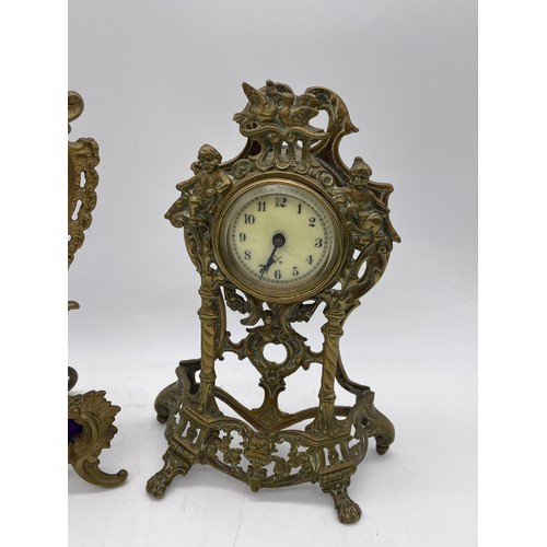 436 - GILT METAL ROCOCO FRAMED EASEL BACK TIME PIECE AND A CHERUB ROCOCO FRAMED DRUM TIME PIECE