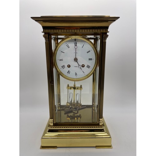 499 - GILT METAL CASED FRENCH FOUR PANE CLOCK WITH DOUBLE WEIGHT MOVEMENT AND KEYS