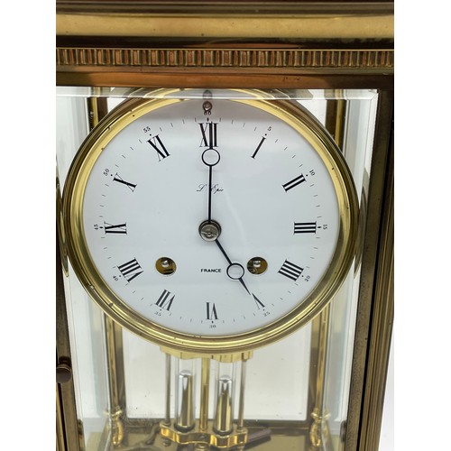 499 - GILT METAL CASED FRENCH FOUR PANE CLOCK WITH DOUBLE WEIGHT MOVEMENT AND KEYS