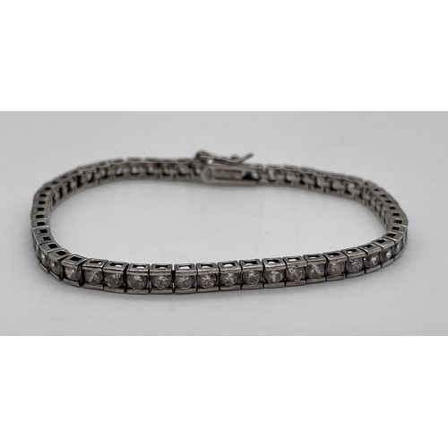 566 - 925 SILVER AND CZ TENNIS BRACELET