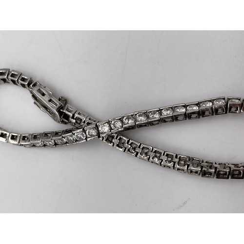 566 - 925 SILVER AND CZ TENNIS BRACELET