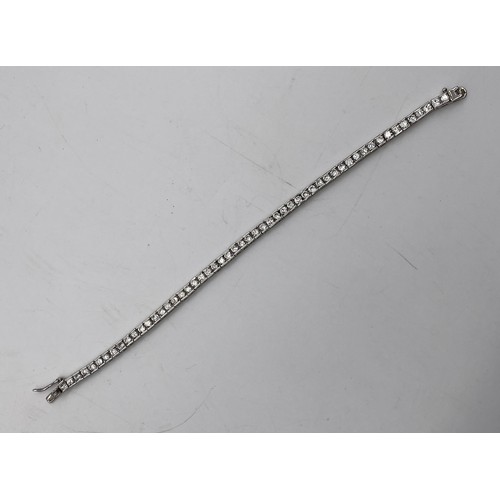 566 - 925 SILVER AND CZ TENNIS BRACELET