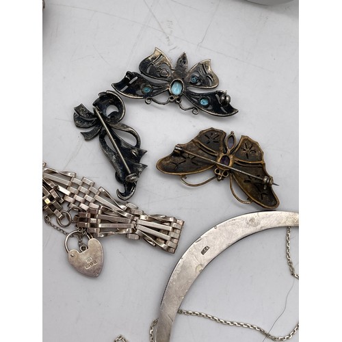 574 - SILVER ENGRAVED BANGLE, SILVER CRESCENT CHAIN, MARCASITE BUTTERFLY BROOCHES AND A FIVE BAR GATE BRAC... 