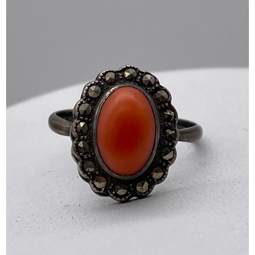 569 - 925 SILVER CORAL CABOCHON AND MARCASITE CLUSTER DRESS RING