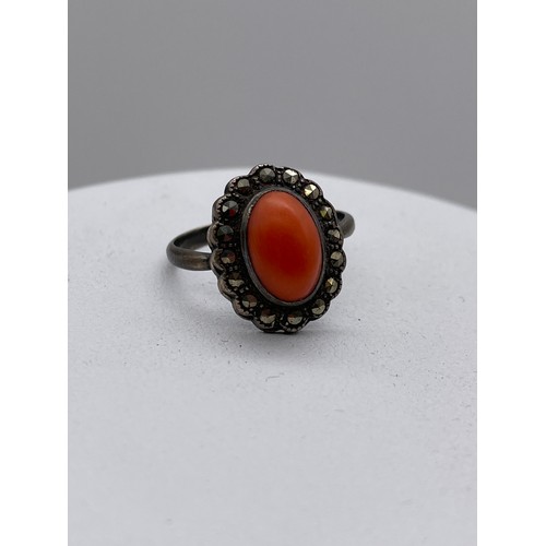 569 - 925 SILVER CORAL CABOCHON AND MARCASITE CLUSTER DRESS RING