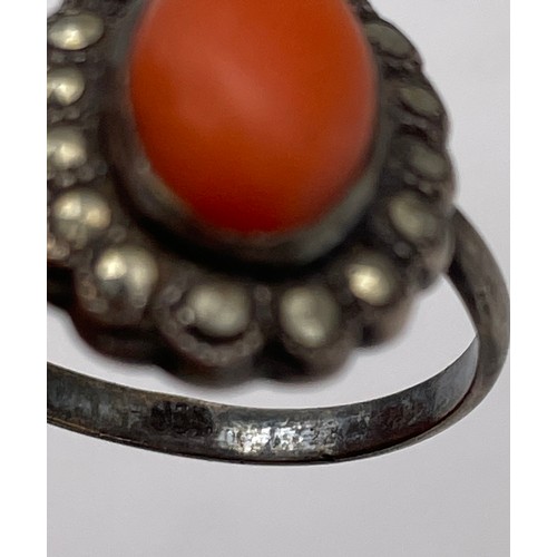 569 - 925 SILVER CORAL CABOCHON AND MARCASITE CLUSTER DRESS RING