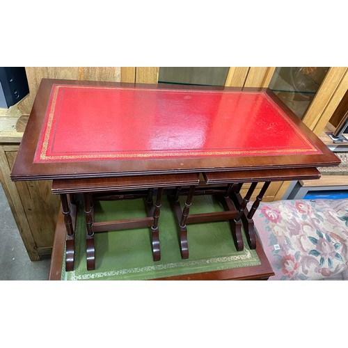 142G - REPRODUCTION MAHOGANY GILT LEATHER TOPPED NEST OF TABLES