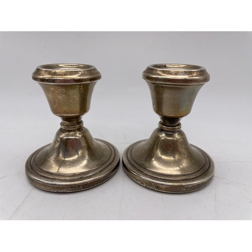 492 - PAIR OF SILVER CANDLE HOLDERS WITH LOADED BASES