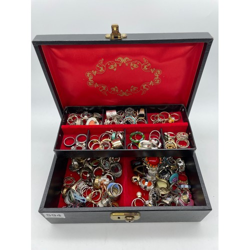 594 - JEWELLERY BOX CONTAINING DRESS RINGS OF VARIOUS STYLES