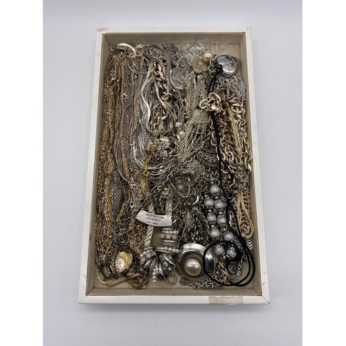 584 - TRAY OF SILVER COLOURED METAL CHAINS, PENDANTS AND NECKLACES