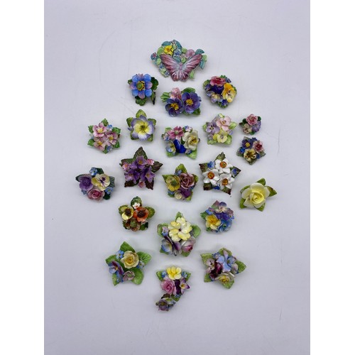 589 - SELECTION OF PORCELAIN FLORAL ENCRUSTED BROOCHES