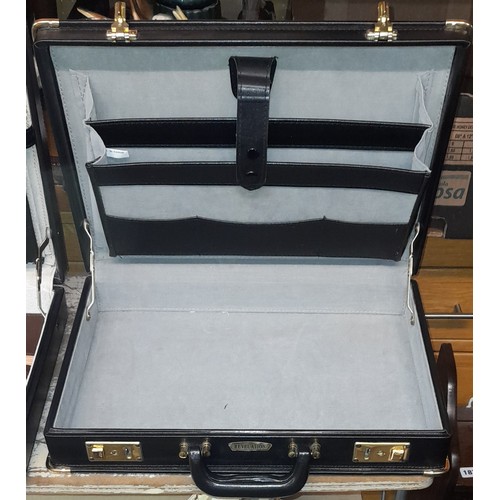 543 - ONE COMBINATION LO0CK BRIEF CASE AND ONE KEY LOCK BRIEFCASE