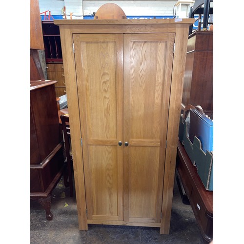 200 - OAK NARROW TWO DOOR CUPBOARD