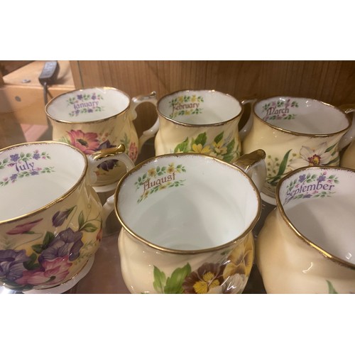 398 - COMPLETE SET OF QUEENS CHINA FLORAL MONTH TEACUPS