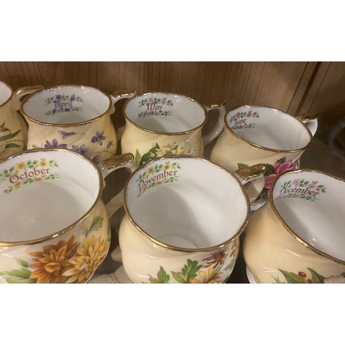 398 - COMPLETE SET OF QUEENS CHINA FLORAL MONTH TEACUPS