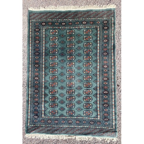 113 - GEOMETRIC PATTERNED GREEN GROUND CARPET