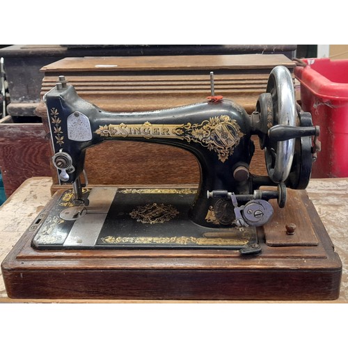 538 - VINTAGE MANUAL OAK CASED SEWING MACHINE