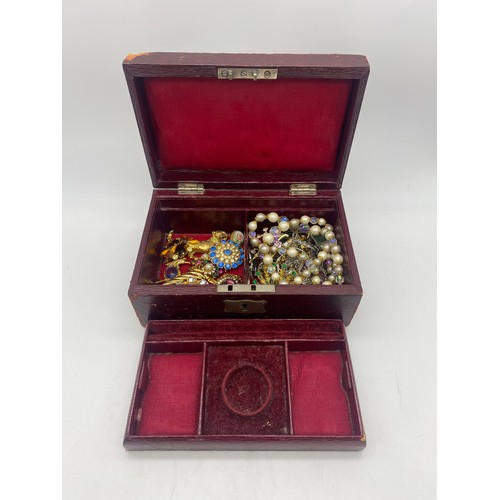 459 - RED MORROCAN LEATHER JEWELLERY BOX CONTAINING VARIOUS FLORAL ENCRUSTED AND ENAMEL BROOCHES