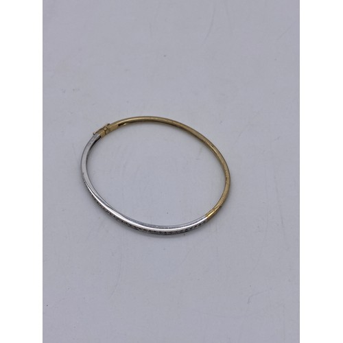 579 - 375 STAMPED YELLOW AND WHITE GOLD BANGLE 9G APPROX