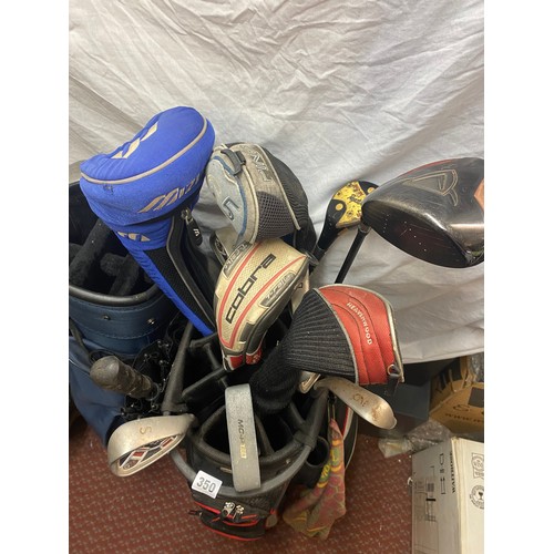 350 - FOUR GOLF BAGS CONTAINING VARIOUS GOLF DRIVERS AND CLUBS