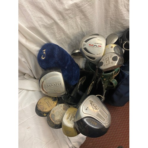 350 - FOUR GOLF BAGS CONTAINING VARIOUS GOLF DRIVERS AND CLUBS