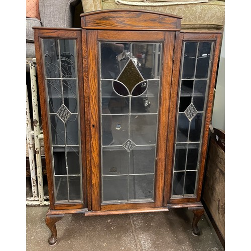 66 - OAKED LEADED GLAZED DISPLAY CABINET ON CABRIOLE LEGS