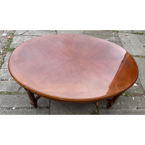 148 - OVAL CROSS BANDED COFFEE TABLE WITH SHAPED CROSS STRETCHERS