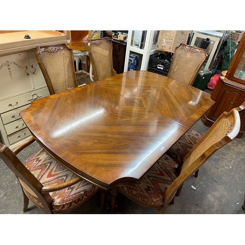 107 - COLONIAL WALNUT AND BERGERE CANED DINING TABLE AND CHAIRS