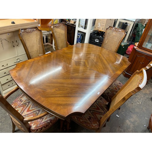 107 - COLONIAL WALNUT AND BERGERE CANED DINING TABLE AND CHAIRS