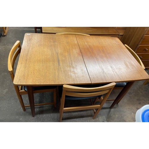 146 - TEAK EXTENDING DINING TABLE AND SIX BEECH LADDER BACK DINING CHAIRS